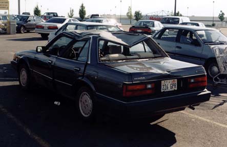 Car in parking lot from left side