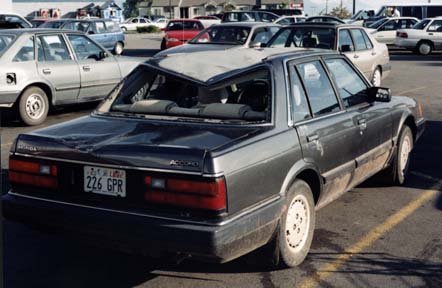 Car in parking lot from right side